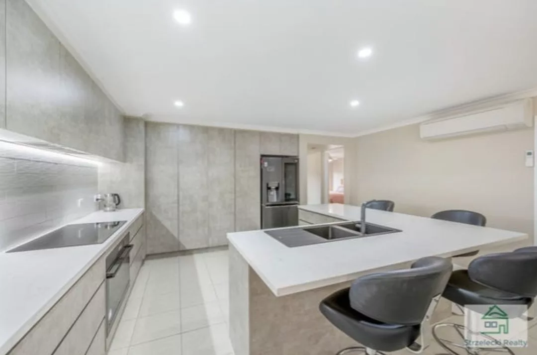 completed kitchen with stone benchtops